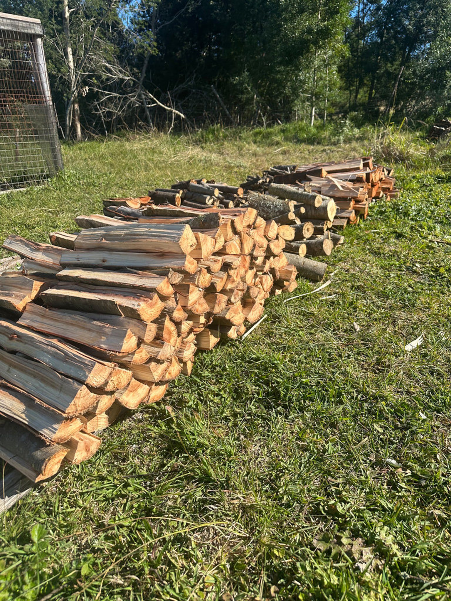 Stacked firewood logs ready for delivery